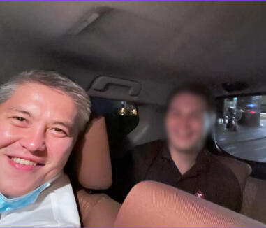 Tim and Rustem in a taxi from a client site